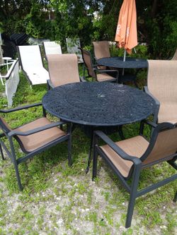 Patio tables with 4 chairs we have 2 sets