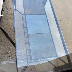 Modern glass top coffee table with metal frame