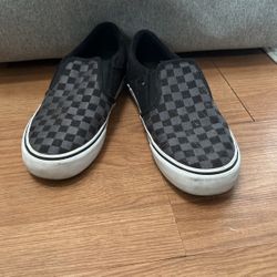 Black and gray checkered Vans