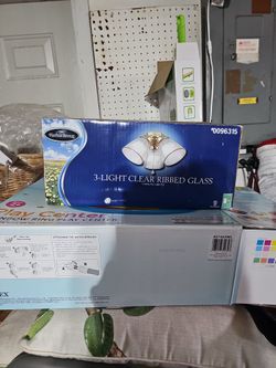 A Harbor Breeze Three Light Clear Rib Glass Ceiling Fan Light Kit