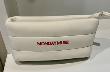 The limited-edition, cream-colored quilted puffer pouch "MONDAY MUSE"