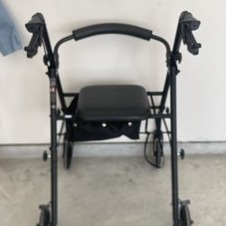 Like-New Sitting Walker with Seat & Storage Pouch