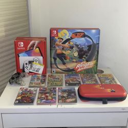 Used Nintendo Switch OLED With 8 Games, Switch Case, Ring Fit Adventure Set, And Pro Controller