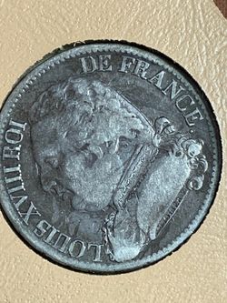 5 Francs silver coin from France, featuring the crowned arms of Louis XVIII.The coin is dated 1814 and bears the mint mark 'Q' for Perpignan.Similar s