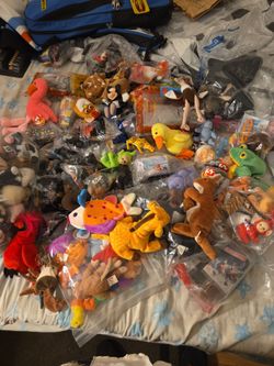 Assorted beanie babies, mcdonalds toys, burger king, jack in the box and others
