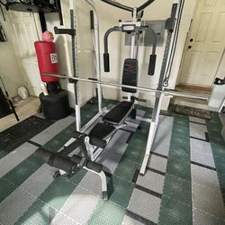 Home Gym - Marcy - Smith rack and adjustable bench - pull down attachments and butterfly and row