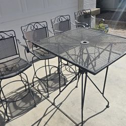 $350  IRON SWIVEL 4 BARSTOOLS AND TABLE 