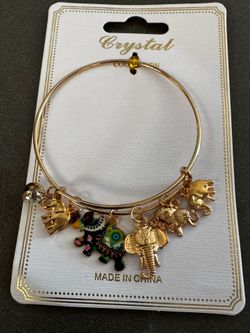 Gold elephant charm bangle bracelet