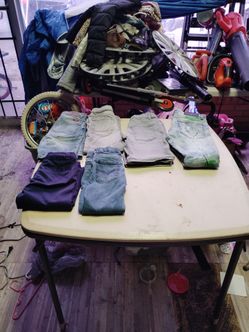 Three jeans pants and two jeans shorts and one uniform pant