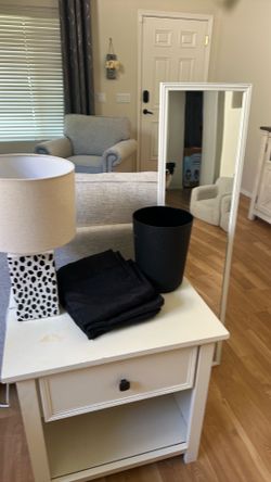 Mirror, lamp, trash can, and blackout curtains