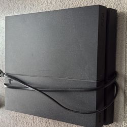 PS4 with controller and headset