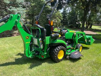 John Deere 1025r diesel compact tractor with loader bucket backhoe and 60 in drive over deck