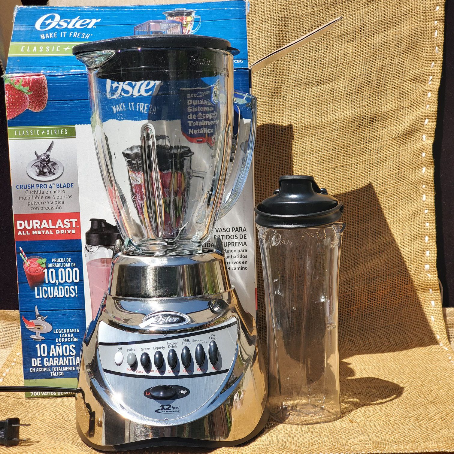 NEW OSTER Chrome12 Speed Blender with 6 cup Glass Jar and 20 Oz Planstic Blend- n- go Smoothie cup