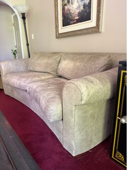 Free leather curved loveseat