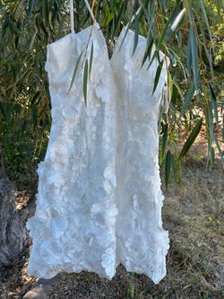 Wedding dress—or whatever you'd like to wear it for—by Xscape; size 2, white.