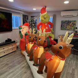 Holiday Inflatable Bundle – Giant Grinch + Santa Sleigh