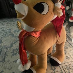 This is a Rudolph the Red-Nosed Reindeer plush greeter