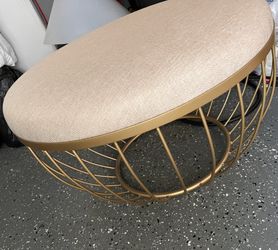 HomeSullivan - Beige Linen Gold Metal Upholstered Round Ottoman