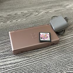 Nintendo DS with a game, complete with matching stylus & charger. $55