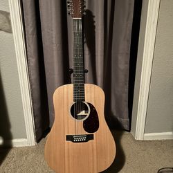 Martin 12 string acoustic/electric w/ Tonewood amp installed. Amazing effects. Solid Spruce top.