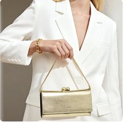 New in box Gold Chunli purse