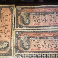 These are 1954 Canadian two-dollar bills. DevilsHead