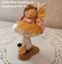 Adorable 'Little Fairy' sleeping on mushroom