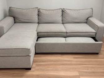 Bob’s furniture gray sleeper sectional
