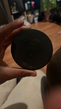 Black hockey puck form pro player