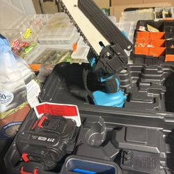 Miniature Chainsaw With Extra Chain, Two Extra Batteries And Case