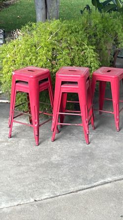 5 red metal stools. $10.00 each