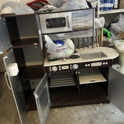 Kids Kitchen With Food And Dishes