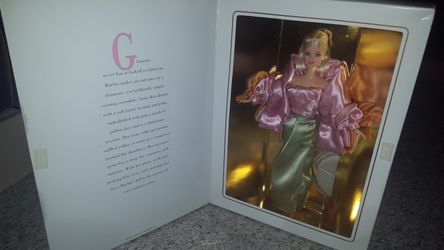 Box is a little stained. Doll is brand new in box!