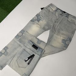 Amiri jeans (light wash star patches)