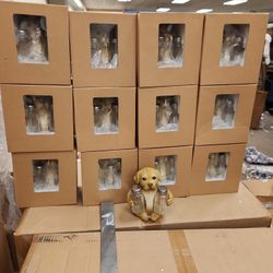 Case of 12 new Labrador holding salt and pepper shakers.