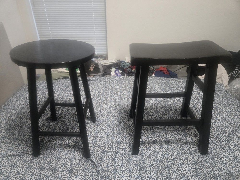 2  mismatched  Pier 1  Imports black wood  stools  $10  each  / $20 for both