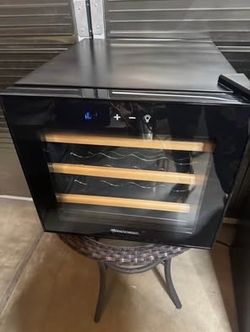 Wine Enthusiast - 12 Bottle Wine Cooler - Black. It’s available as long as you see it  With wood shelves in excellent condition