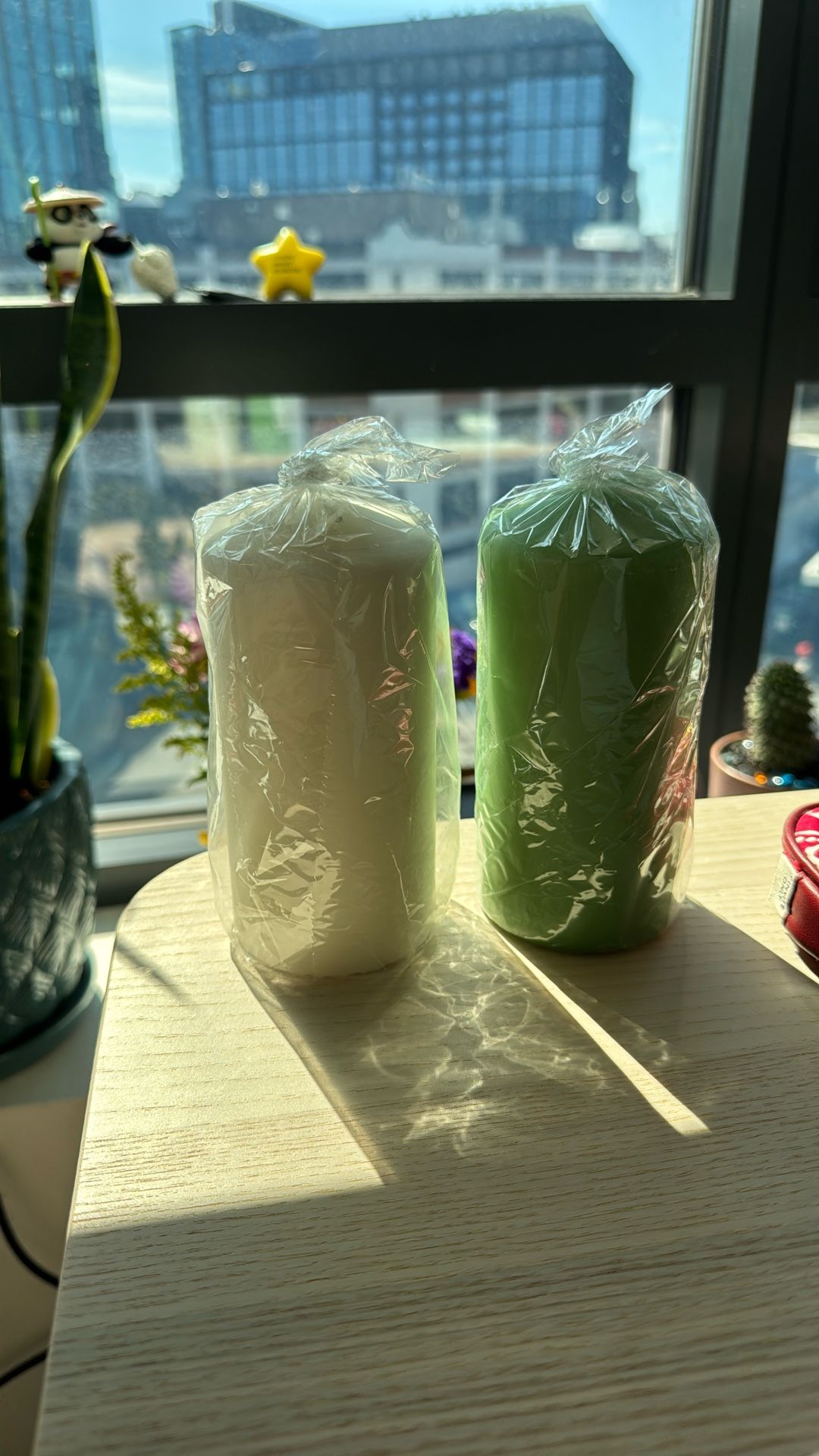 Two Candles - One Green One White.