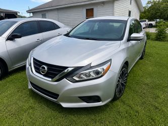 Nissan Altima Silver 4-Door Sedan drive off 1500