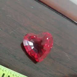 red crystal heart paperweight, likely a Swarovski