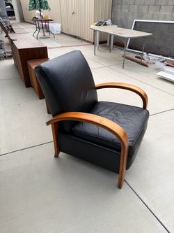 Black leather and wood recliner chair