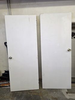 Two White Interior Doors with Knobs