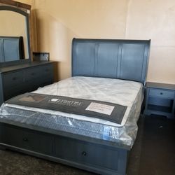 Charcoal gray queen platform storage bedroom set with a plush tranquility mattress