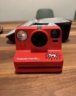 Polaroid Now Keith Haring Edition Instant Camera. Comes with case and charger.
