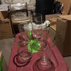 Mix of large and small candle holders or Flower vases or votives