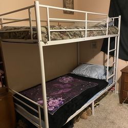 White twin metal bunk bed