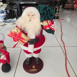 Vintage Christmas decor lot: Old World 2000 Santa Claus collectible figure height 9" width 7" $18, two plastic canisters snowman and chef height 10" w