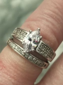Solid 925 silver 2 piece wedding set with a marquise cut white AAA white cz with white cz's in both rings. Sizes 7 and 8.