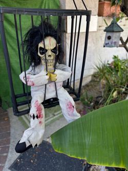 Halloween Skeleton Doll in Hanging Cage animated with motion and speaking