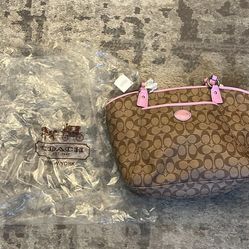 Vintage 2013 Coach Peyton Signature Coated Canvas Tote Bag, in a khaki or brown colorway